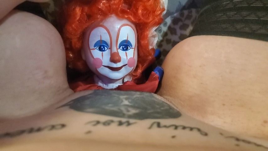 Weird bitch fucks a clown doll