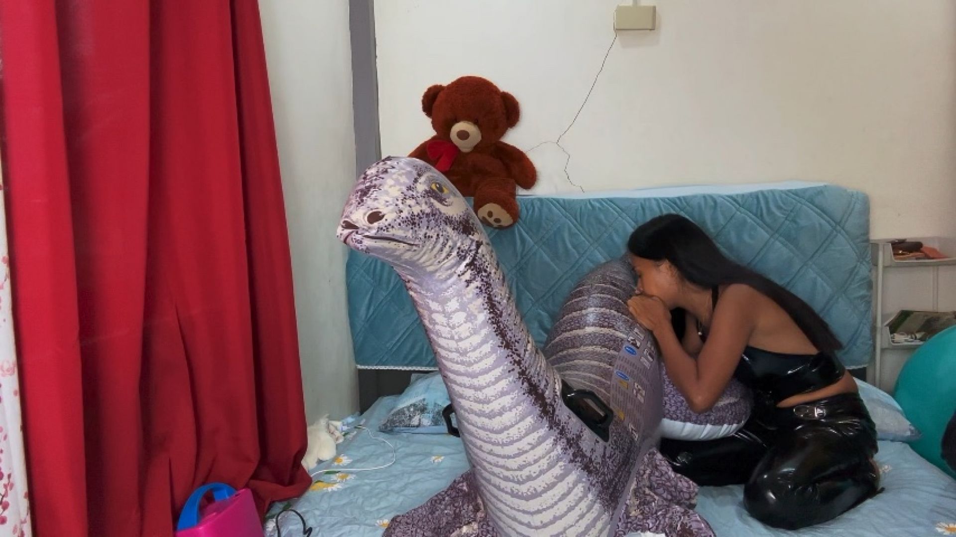 asianloonergirls:Camylle Blows Up Your Inflatable Dinosaur In Leather Outfit