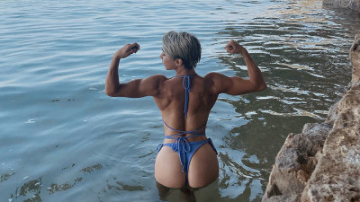 Posing and Muscle show on the beach Muscular Alexa