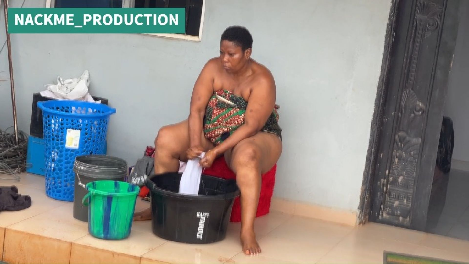 NACKMEPRODUCTION:African mama multitasks on a sunday morning