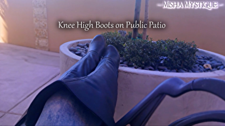Knee High Boots on Public Patio Misha Mystique
